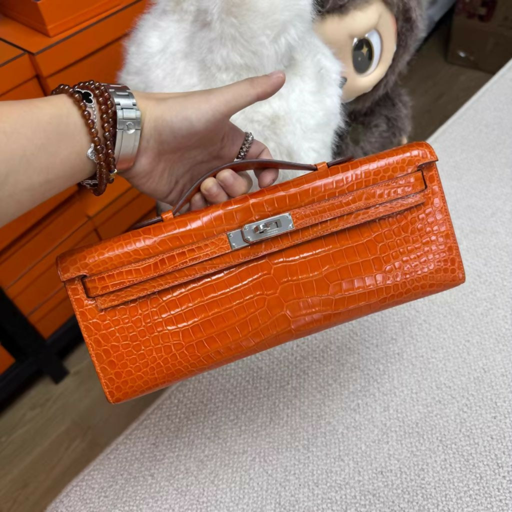 Hermès Kelly Cut Orange Shiny crocodile with Palladium Hardware