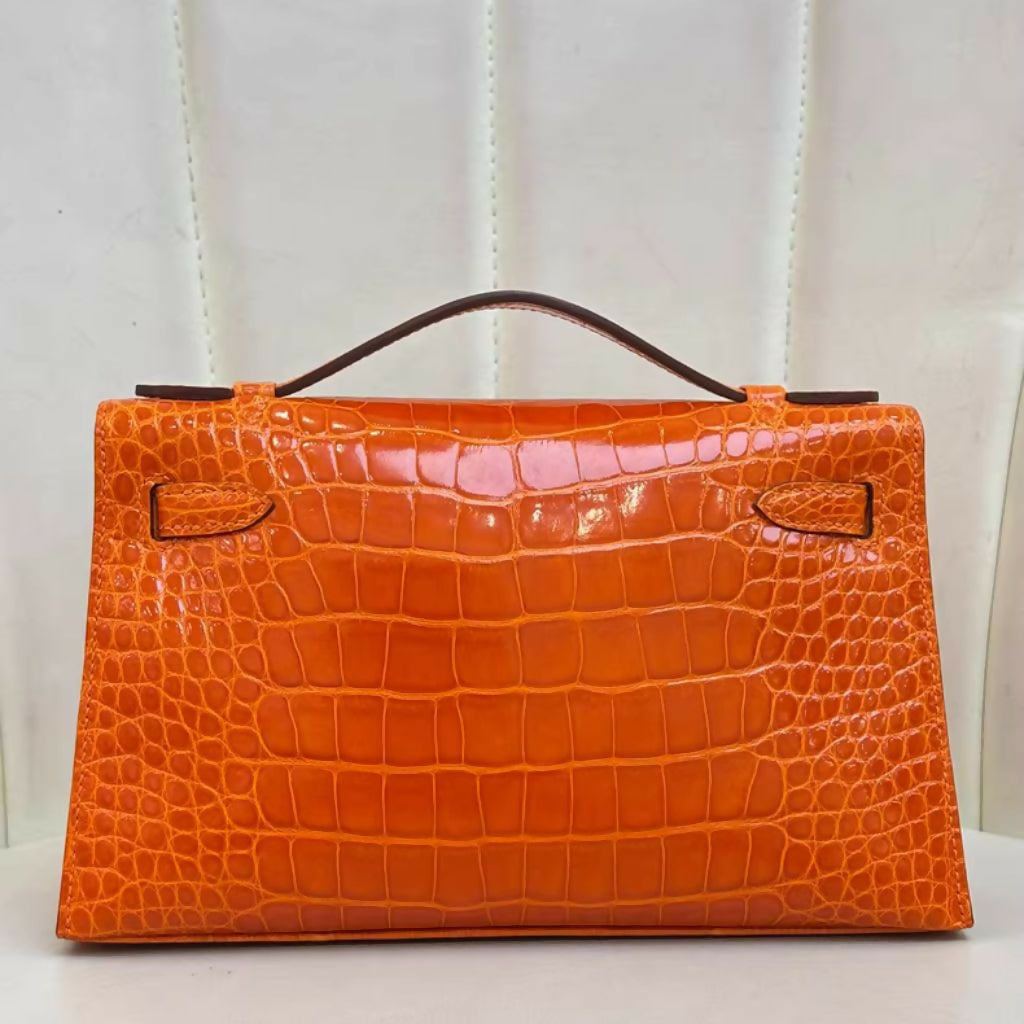 Hermès Mini Kelly Pochette Orange shiny Crocodile Leather Palladium Hardware