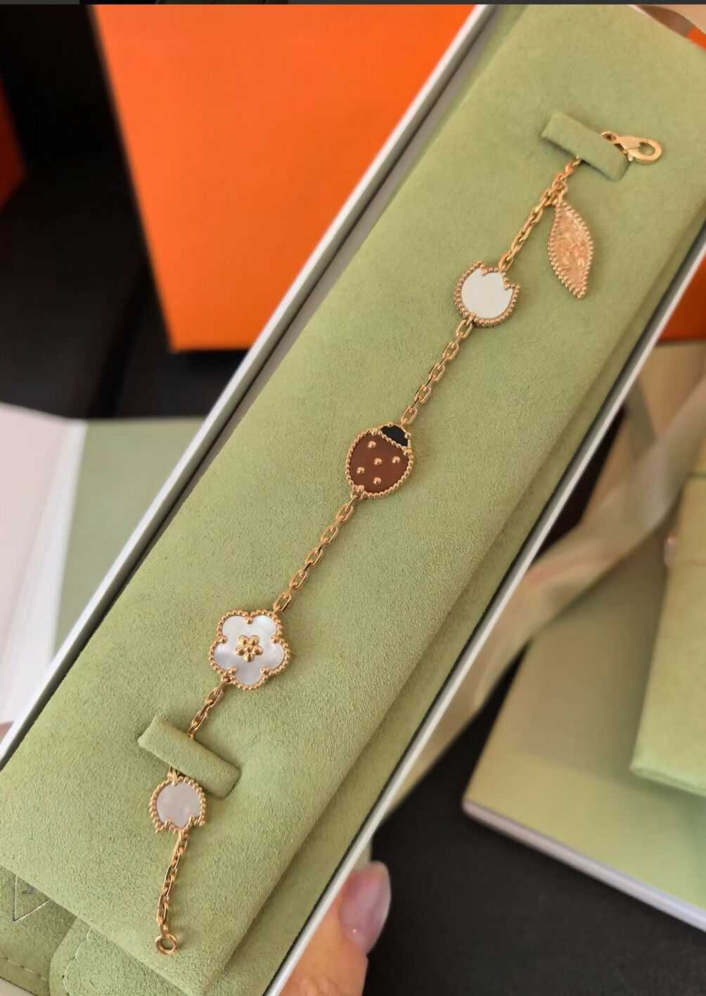 Van Cleef & Arpels Lucky Spring bracelet, 5 motifs 18K rose gold, Carnelian, Mother-of-pearl, Onyx