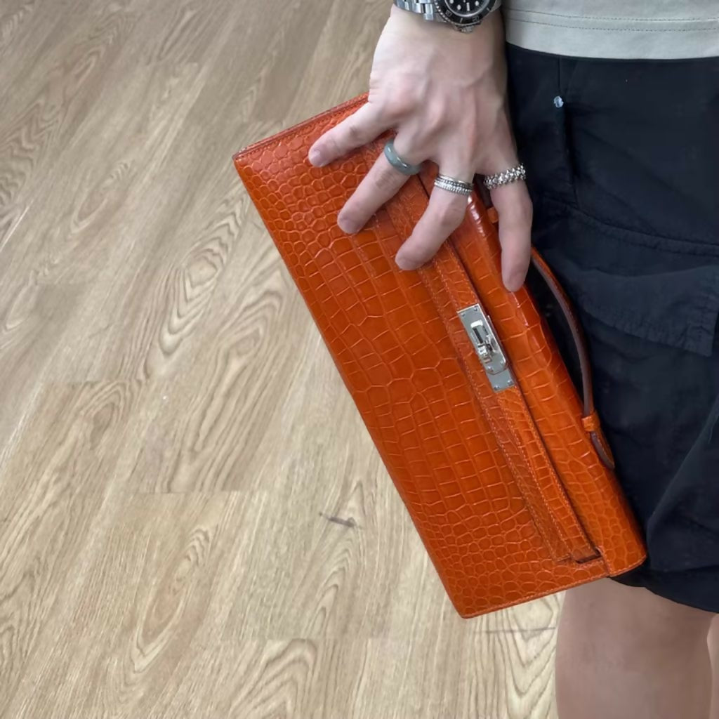 Hermès Kelly Cut Orange Shiny crocodile with Palladium Hardware