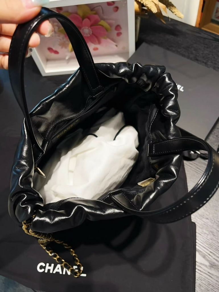 Chanel 24S black & white leather backpack with gold hardware