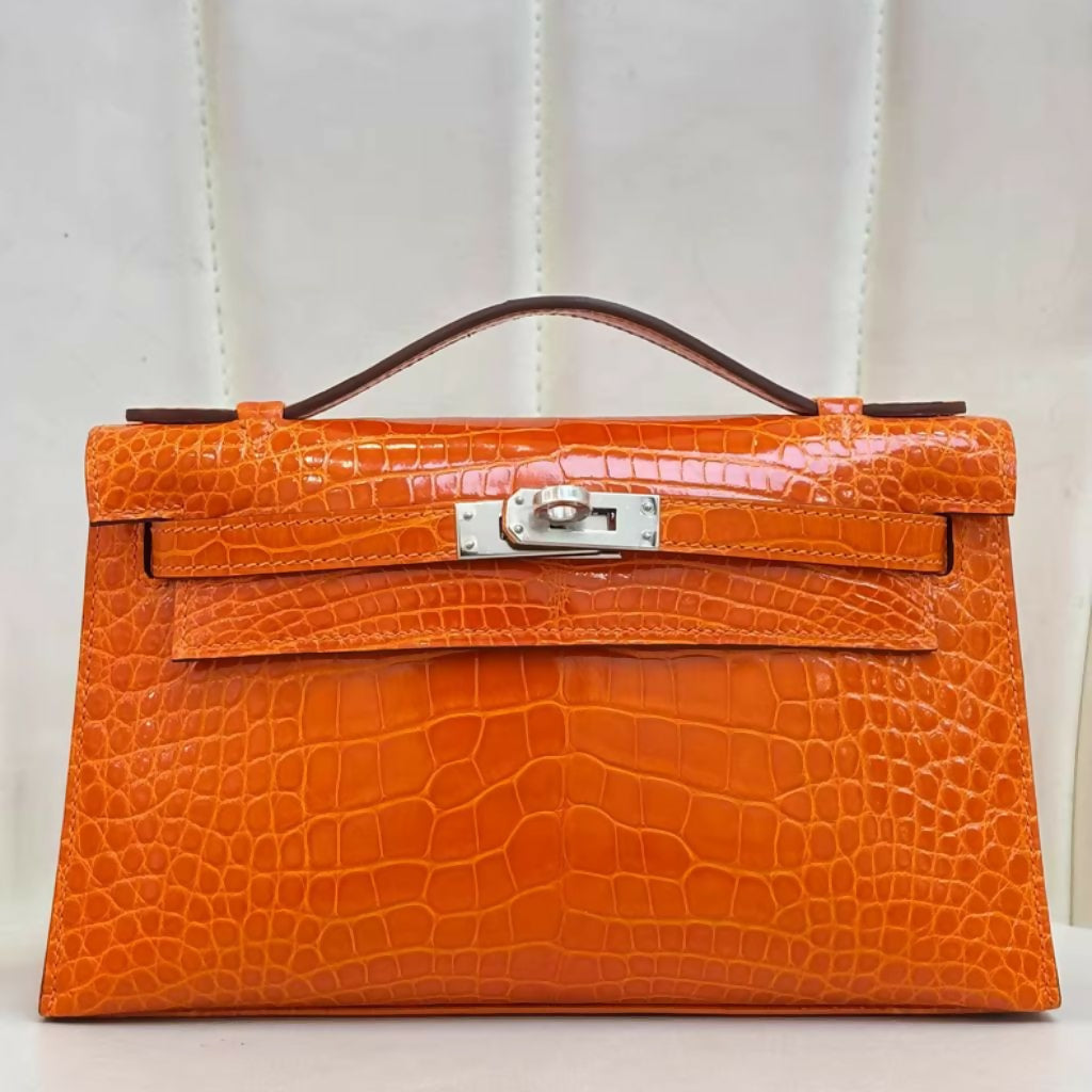 Hermès Mini Kelly Pochette Orange shiny Crocodile Leather Palladium Hardware