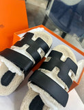 Hermès Black Leather Shearling Chypre Sandals