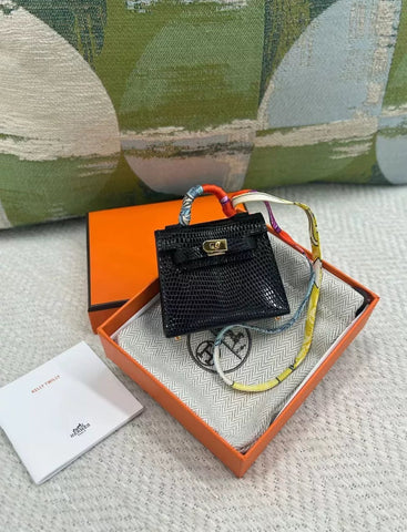 HERMÈS Kelly Twilly charm Noir Lizard Gold Hardware