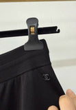 Chanel 25A black wide-leg trousers with white trim