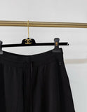 Chanel 25A black wide-leg trousers with white trim